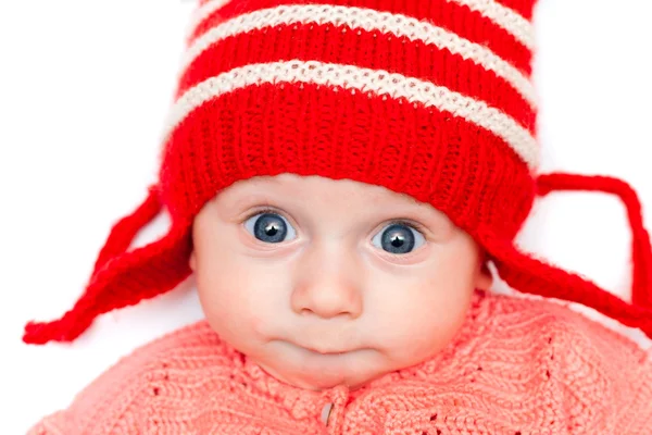 Lycklig pojke i röd hatt Stockbild