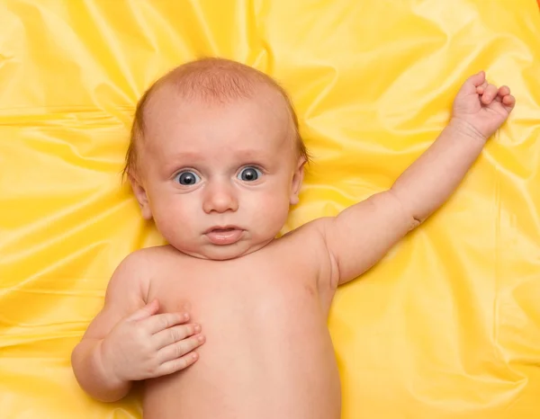 Baby on yellow — Stock Photo, Image