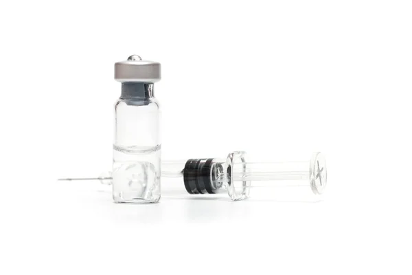 Syringe and vials on white Stock Photo