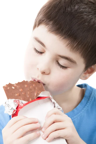 Junge mit Schokolade in der Hand Stockfoto