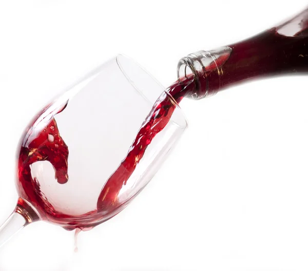 Red wine pouring into glass — Stock Photo, Image