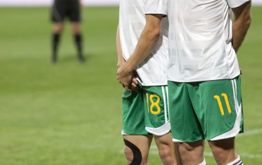 Soccer players prepared to defend free kick clipart