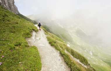 Tourist in Bucegi, Romania clipart