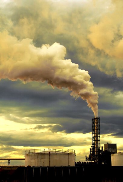 Thick smoke coming out of factory chimney