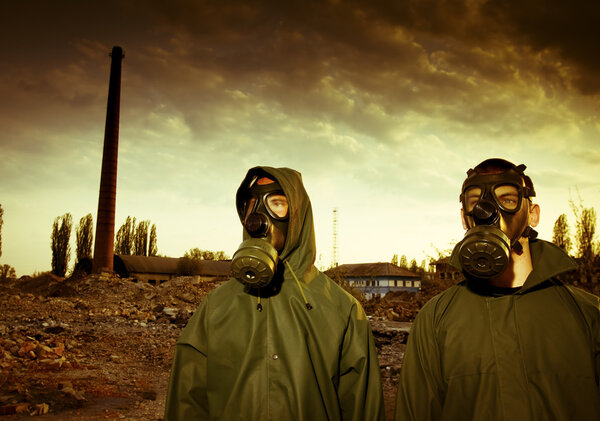 Two man wearing gas masks after nuclear disaster