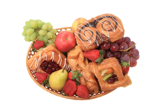 Basket with fruits and pastries. — Stock Photo, Image