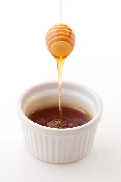 Honing wordt uitgevoerd in een kom — Stockfoto