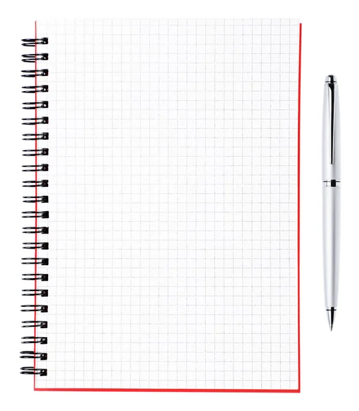 Silver ballpoint pen and blank page of a notebook with black bi — Stock Photo, Image