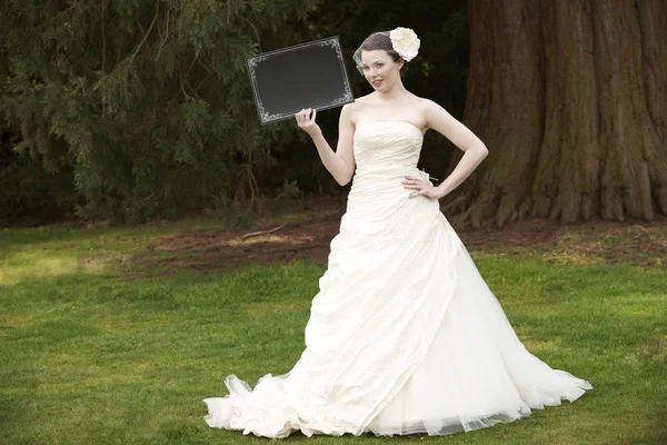 Bride and blank board — Stock Photo, Image