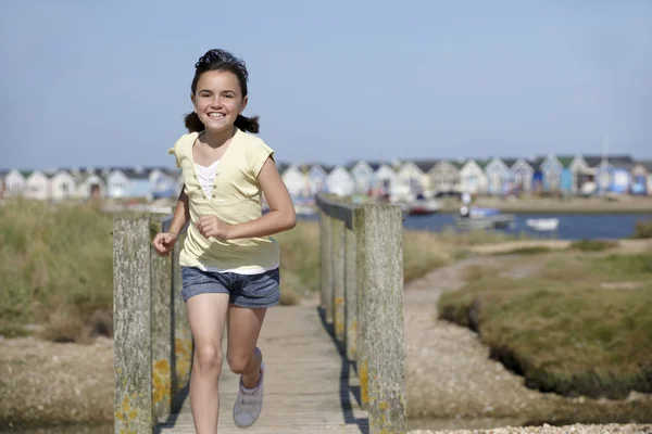 Stock image Young girl running towards camera