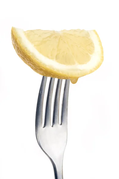 Lemon on fork — Stock Photo, Image