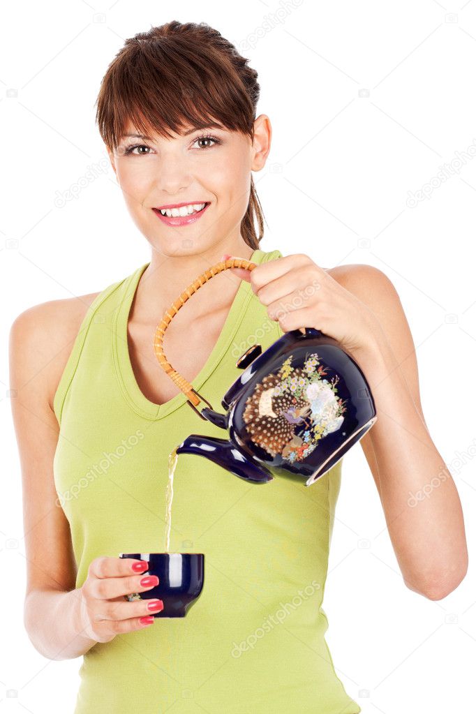Pretty lady smile and pouring tea from teapot