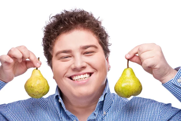 Chubby boy and pear — Stock Photo, Image