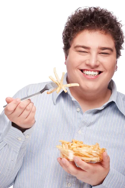 Obtloustlý muž s pommes frites — Stock fotografie
