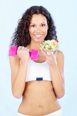 Fitness girl with salad and weight clipart