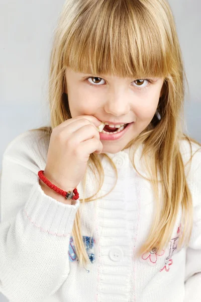 Girl eating candy — Stock Photo, Image