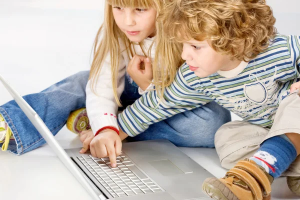 Children turning on computer — Stock Photo, Image