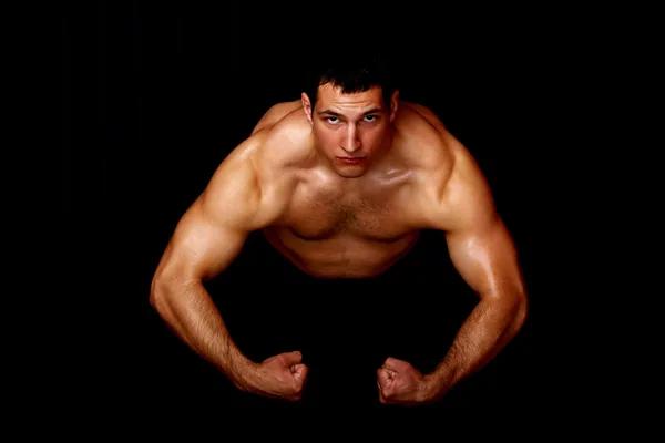 Bodybuilder showing his strength — Stock Photo, Image