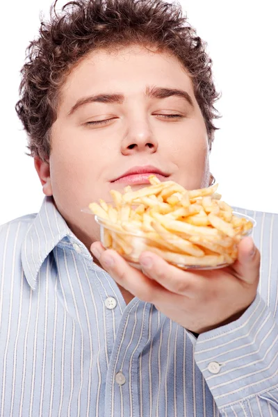Obtloustlý muž s hranolky — Stock fotografie