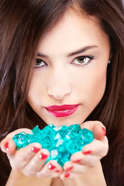 Pretty woman with blue rocks — Stock Photo, Image