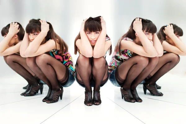 Woman between two mirrors — Stock Photo, Image