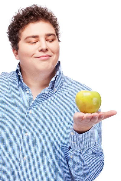Пухкий чоловік тримає яблуко — стокове фото