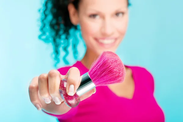 Girl holding powder brush, focus on brush — Stock Photo, Image