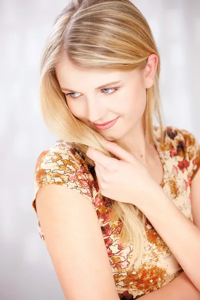 Blond woman with little smile — Stock Photo, Image