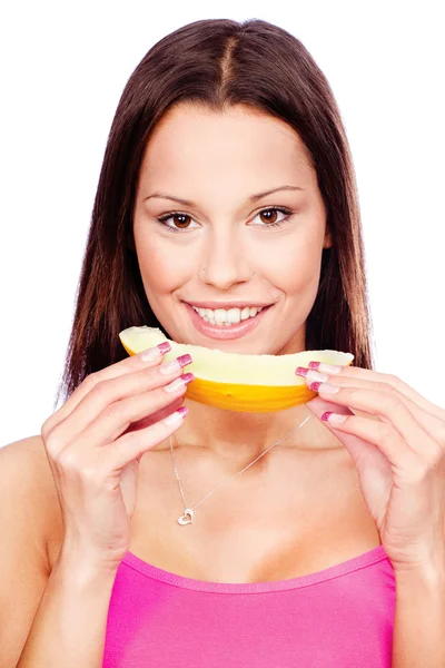 Vrouw met segment van gele meloen — Stockfoto