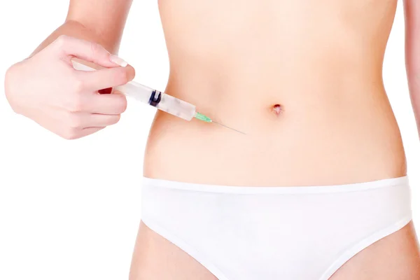 Syringe op vrouw maag — Stockfoto
