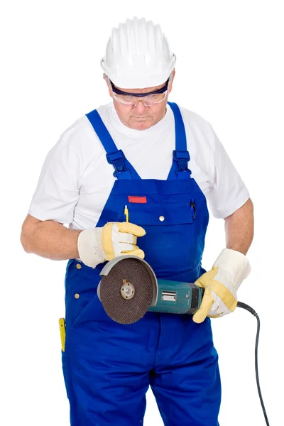Middle age man in worker suite holding surface grinding machine — Stock Photo, Image