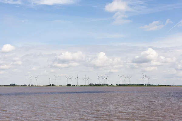 stock image Wind turbines near river