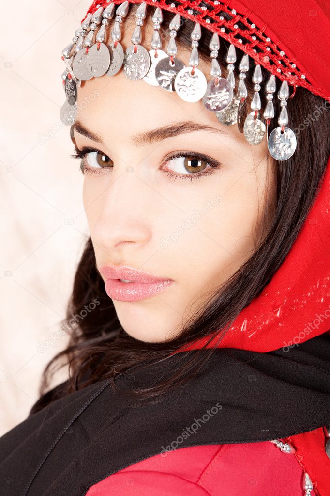 Pretty young woman cover with red scarf
