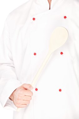 Male chef holding mixing spoon