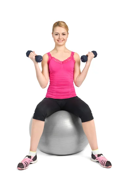 Young woman posing with dumbbells — Stock Photo, Image