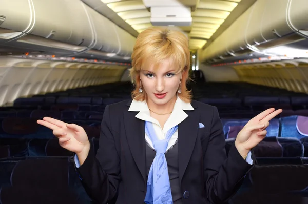 Air hostess gesturing — Stock Photo, Image