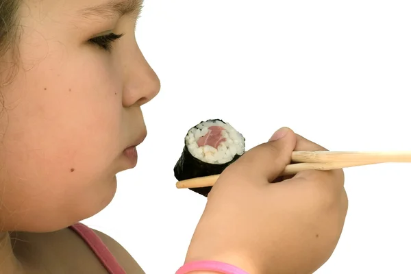 Girl eating sushi — Stock Photo, Image