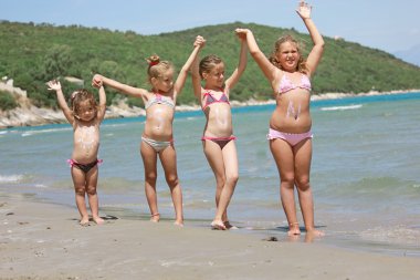 KIds on the sunny beach clipart