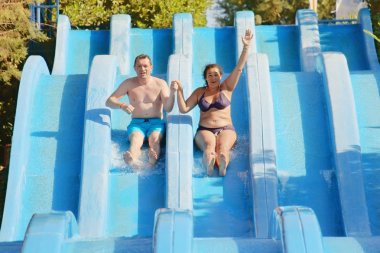 Man and woman in water park clipart