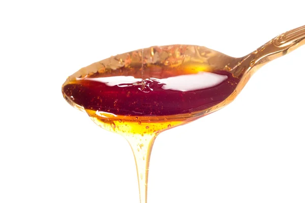 Honey in golden spoon Honey in golden spoon Honey in golden sp — Stock Photo, Image
