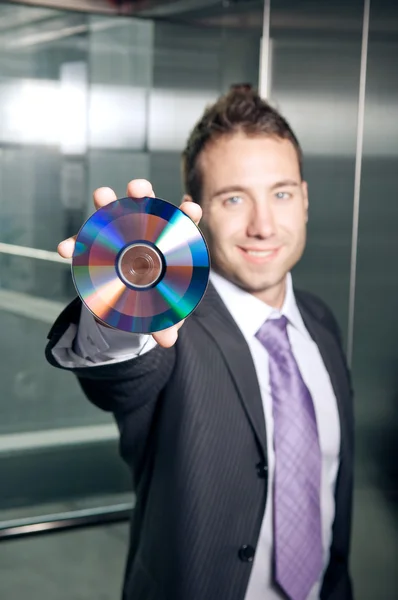 stock image Businessman showing disc