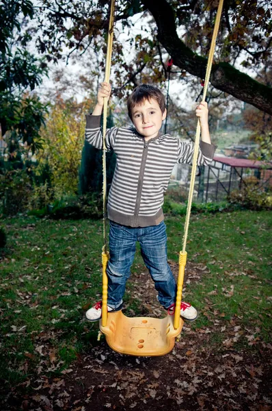 Kid on a swing — Stock Photo, Image