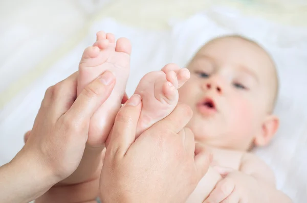 Baby massage Stock Picture