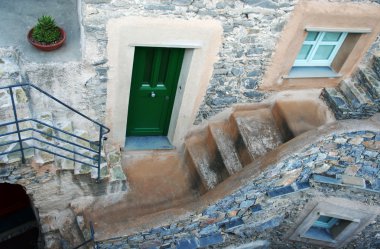 Small house in a full stone village, northern Italy clipart