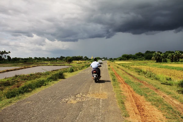 stock image Myanmar landscape with a small road before the storm