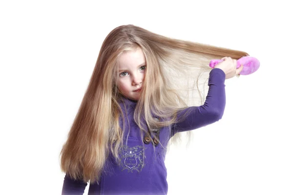 Young girl brushing her hair — Stock Photo, Image