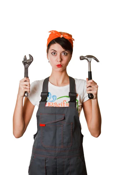 Girl in coveralls with spanner and hammer — Stock Photo, Image