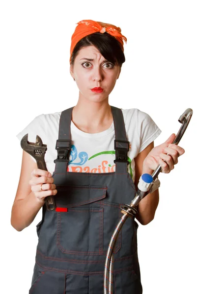 Confused girl trying to repair tap — Stock Photo, Image