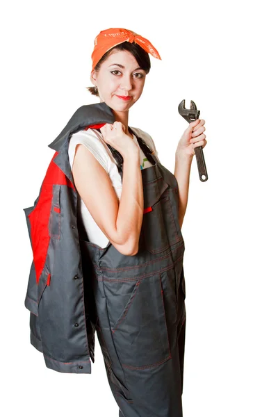 Girl in coveralls with spanner — Stock Photo, Image