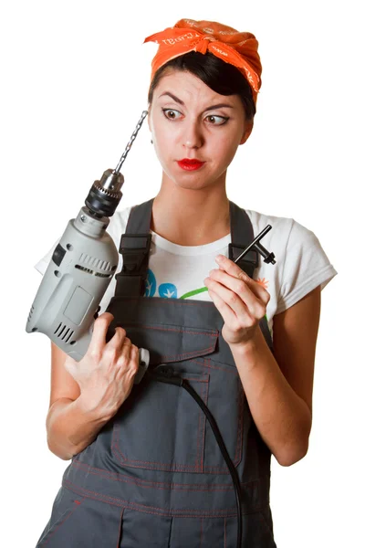 Surprised girl with tools — Stock Photo, Image